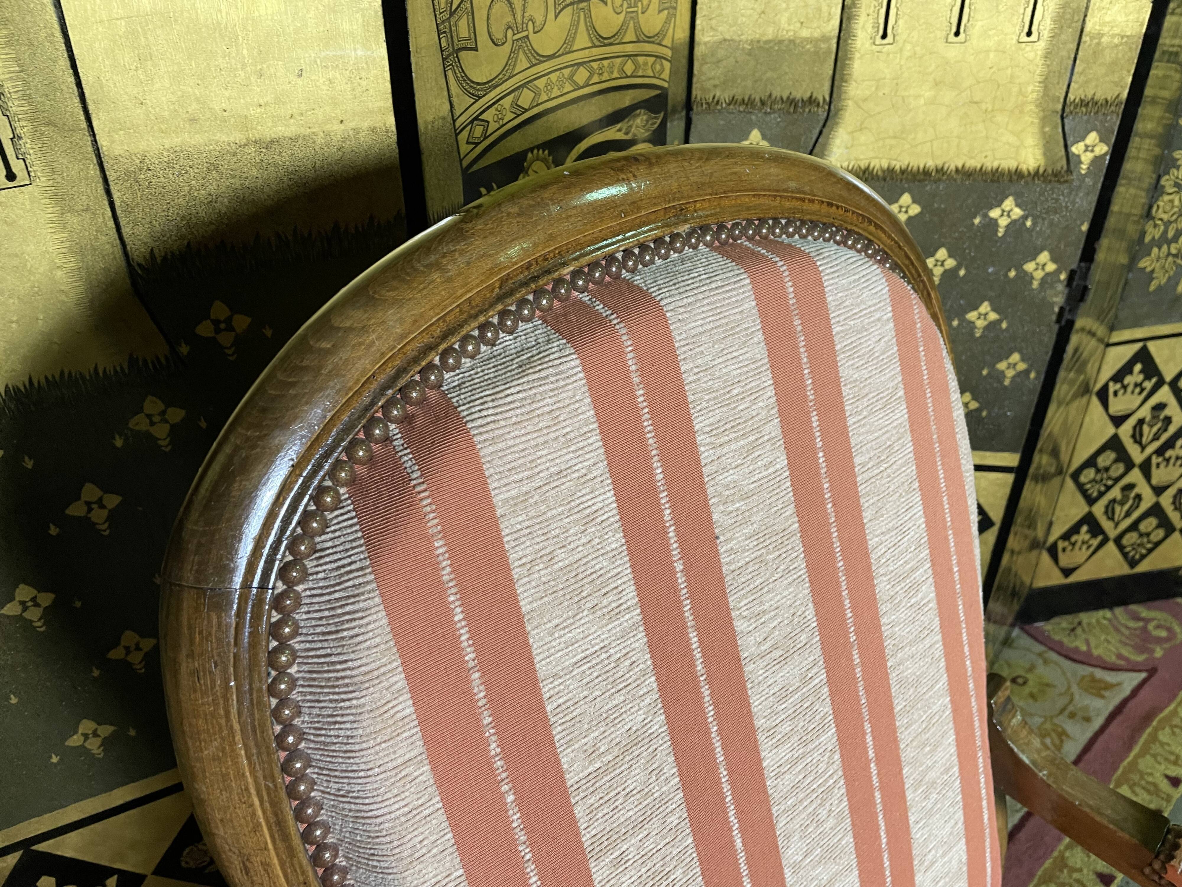 Voltaire walnut armchair