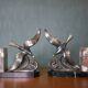 Pair of art deco seagull bookends in regulates and marble, bookcase, desk