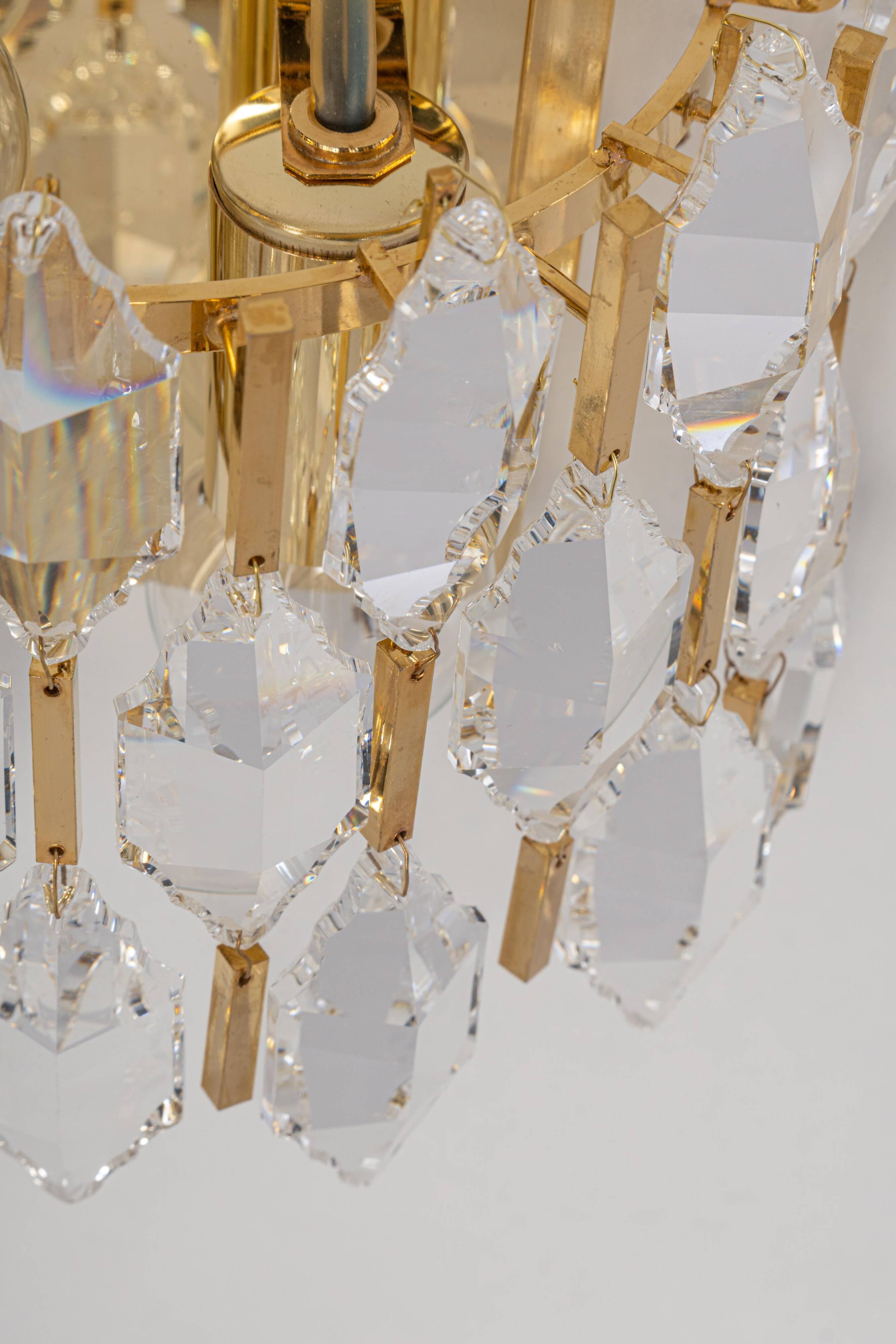 Pair of wall sconces in gilded brass and crystal by Palwa, Germany, 1970s.