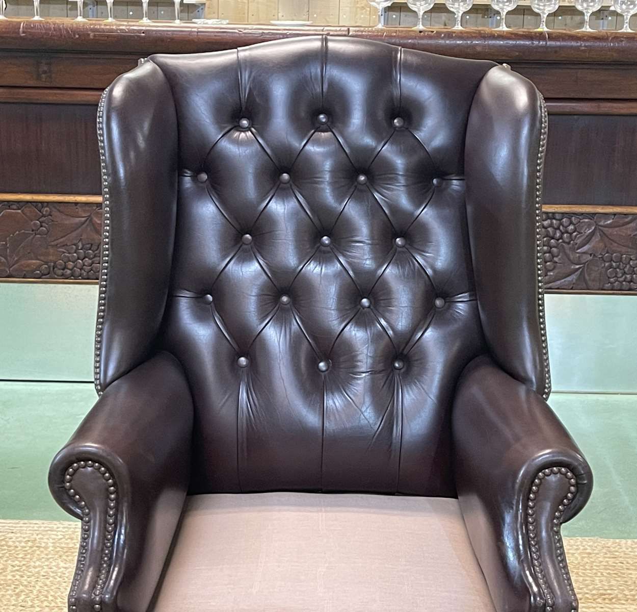 Chesterfield armchair with brown leather ears from the 1990s in very good condition
