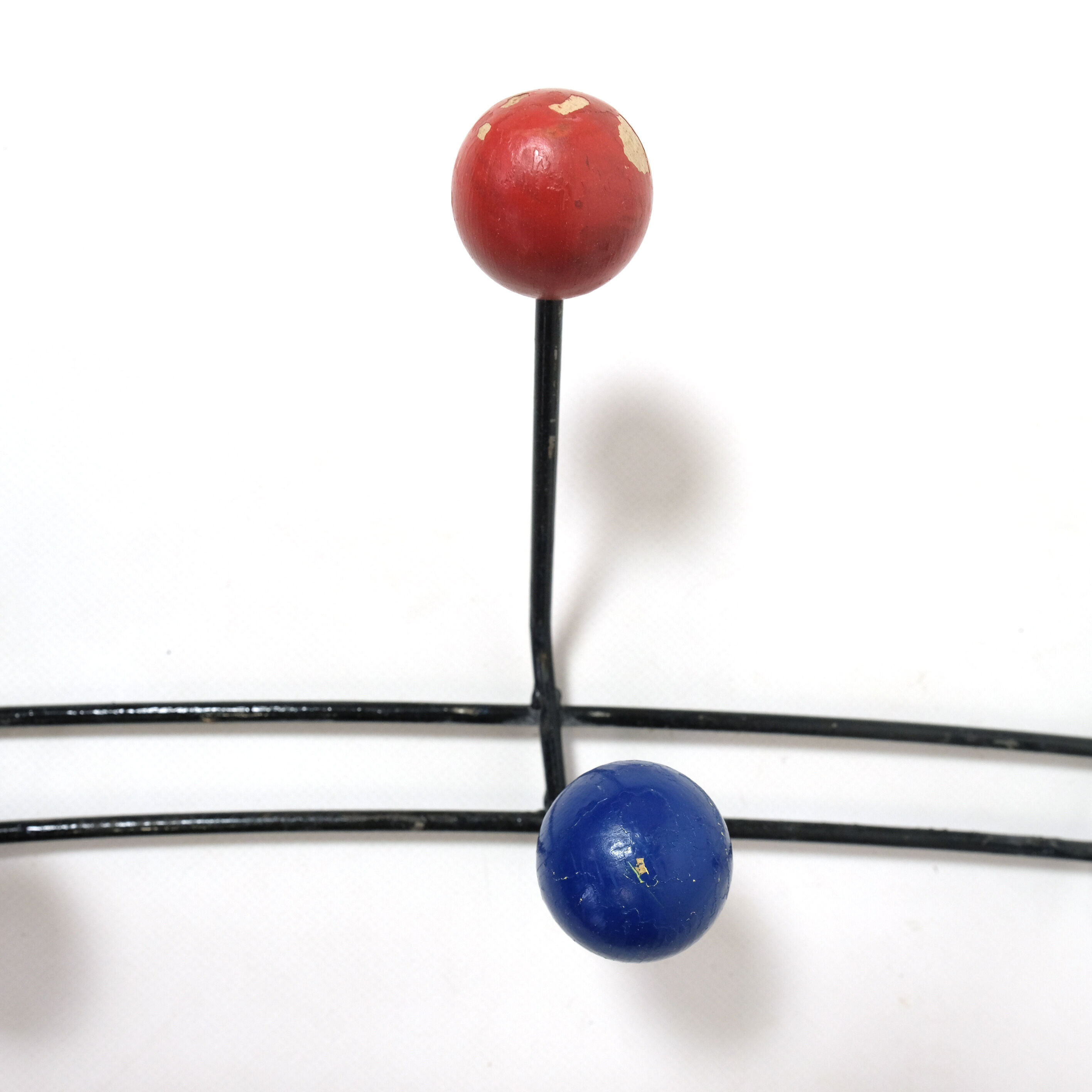 Multicolored wooden and metal coat holder