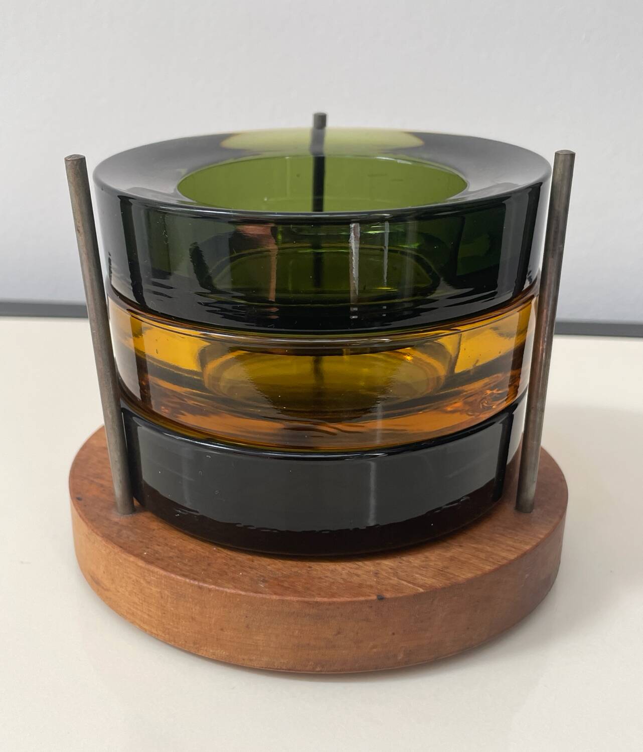 Set of 3 stackable glass catchalls with a teak base.