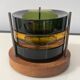 Set of 3 stackable glass catchalls with a teak base.