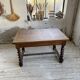Paneled walnut desk with turned legs, 1900