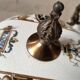 Lustrous bronze, copper and gien-style earthenware.