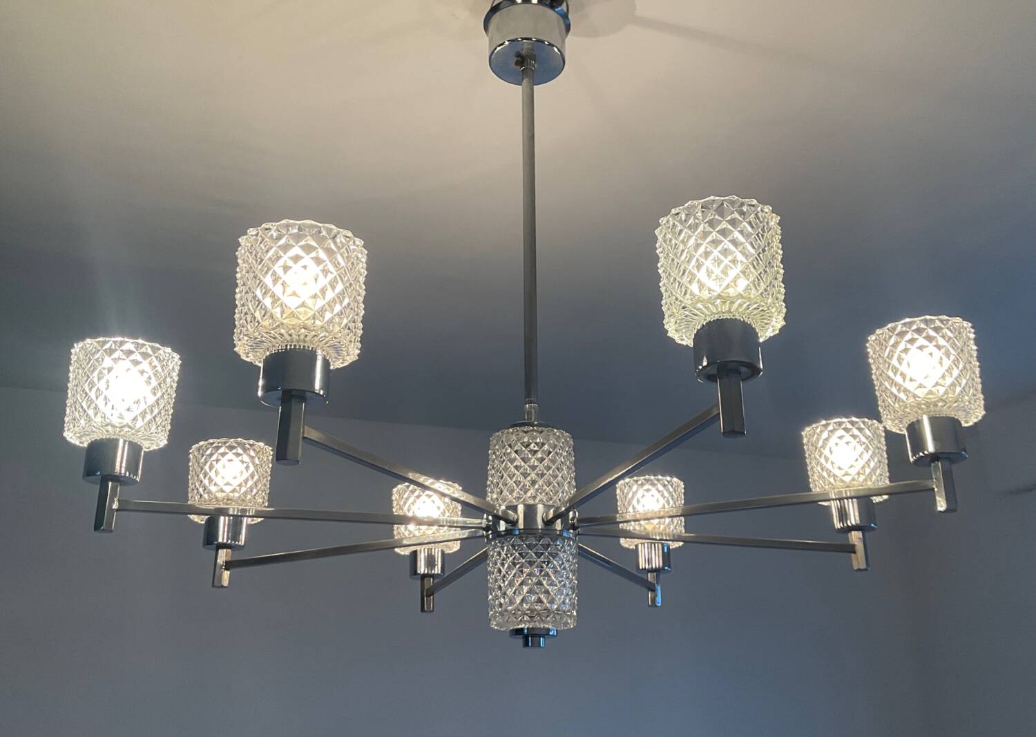 Vintage Italian chandelier from the 60s in chromed metal and glass