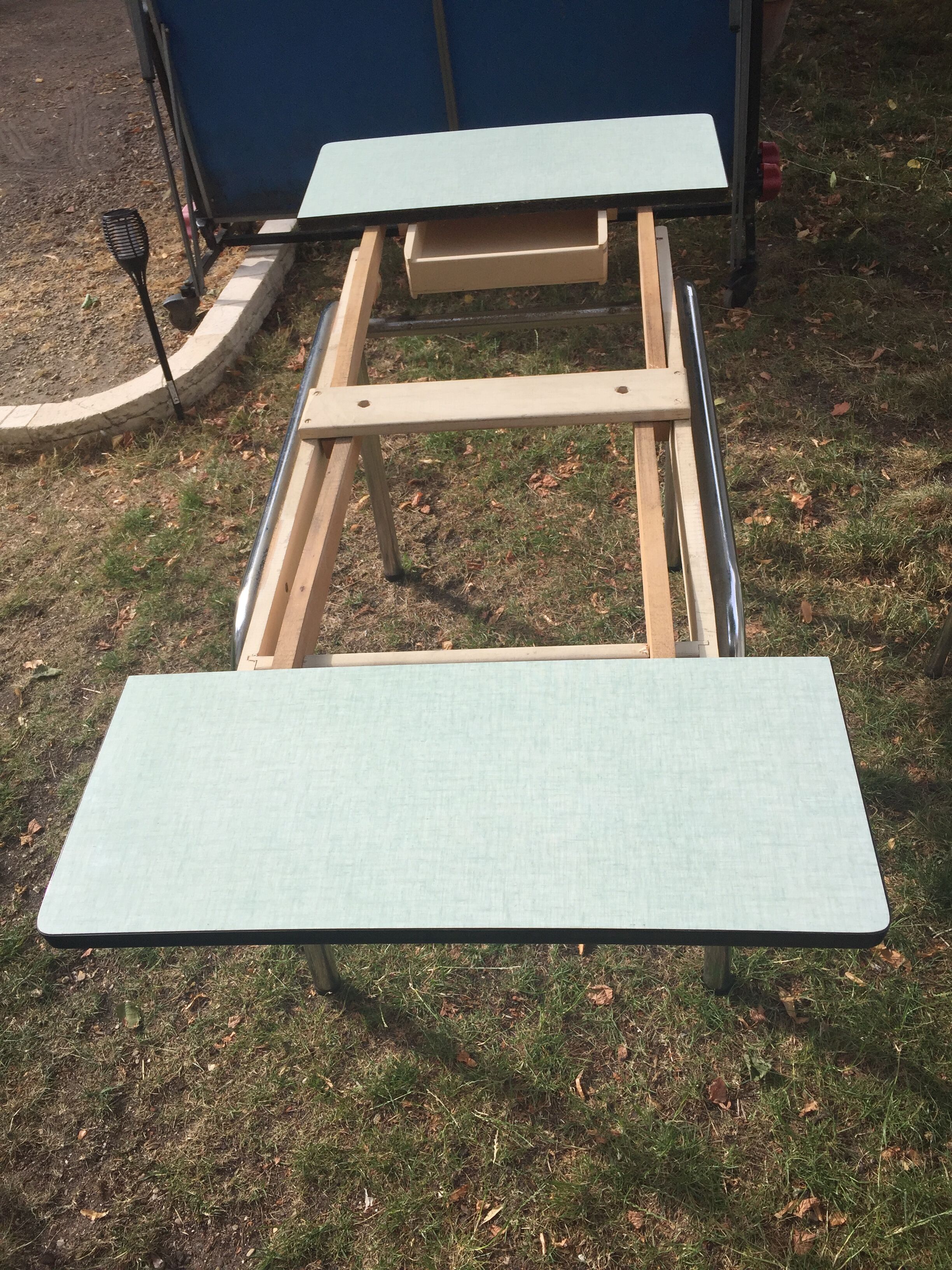 Table and 4 green water formica chairs 60's