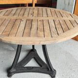 Industrial table with cast iron legs and teak top