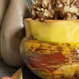 Old provencal pot cover in glazed terracotta