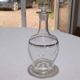 Blown glass decanter, engraved and chiselled. Made in France.