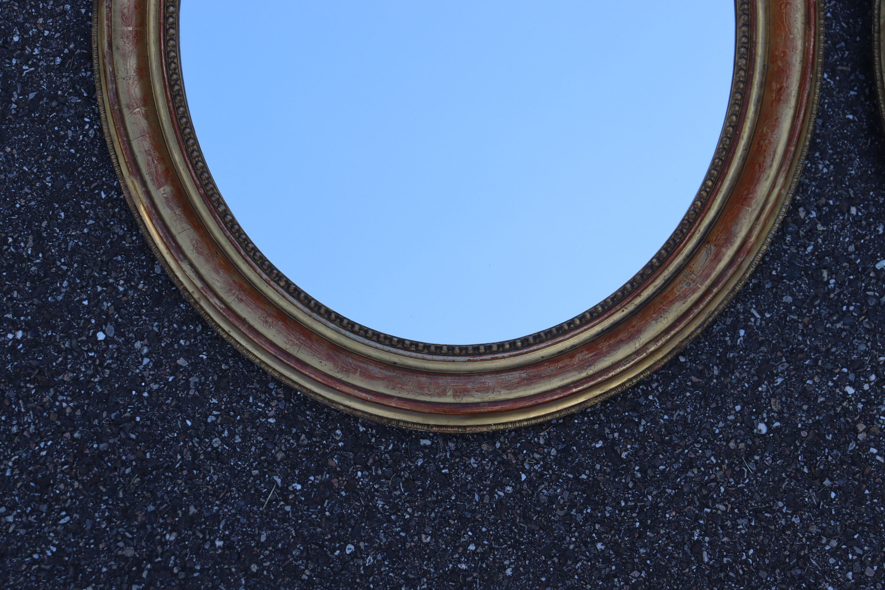 Pair of oval mirrors from the Louis Philippe period in gilded wood.
