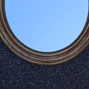 Paire de miroirs ovales en bois doré époque Louis Philippe