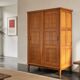 Vintage wooden wardrobe with sliding doors