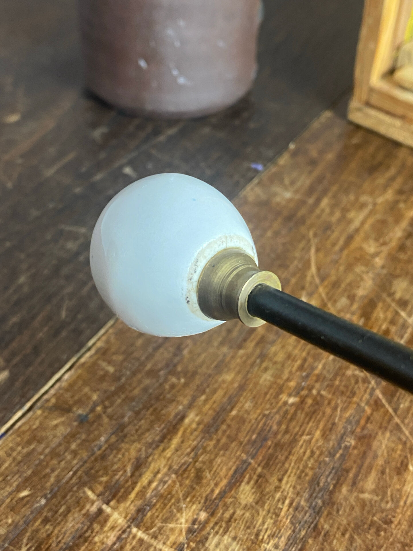 Metal and porcelain hook