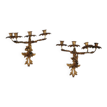 Antique wall sconces in gilded bronze, 20th century, in baroque style.