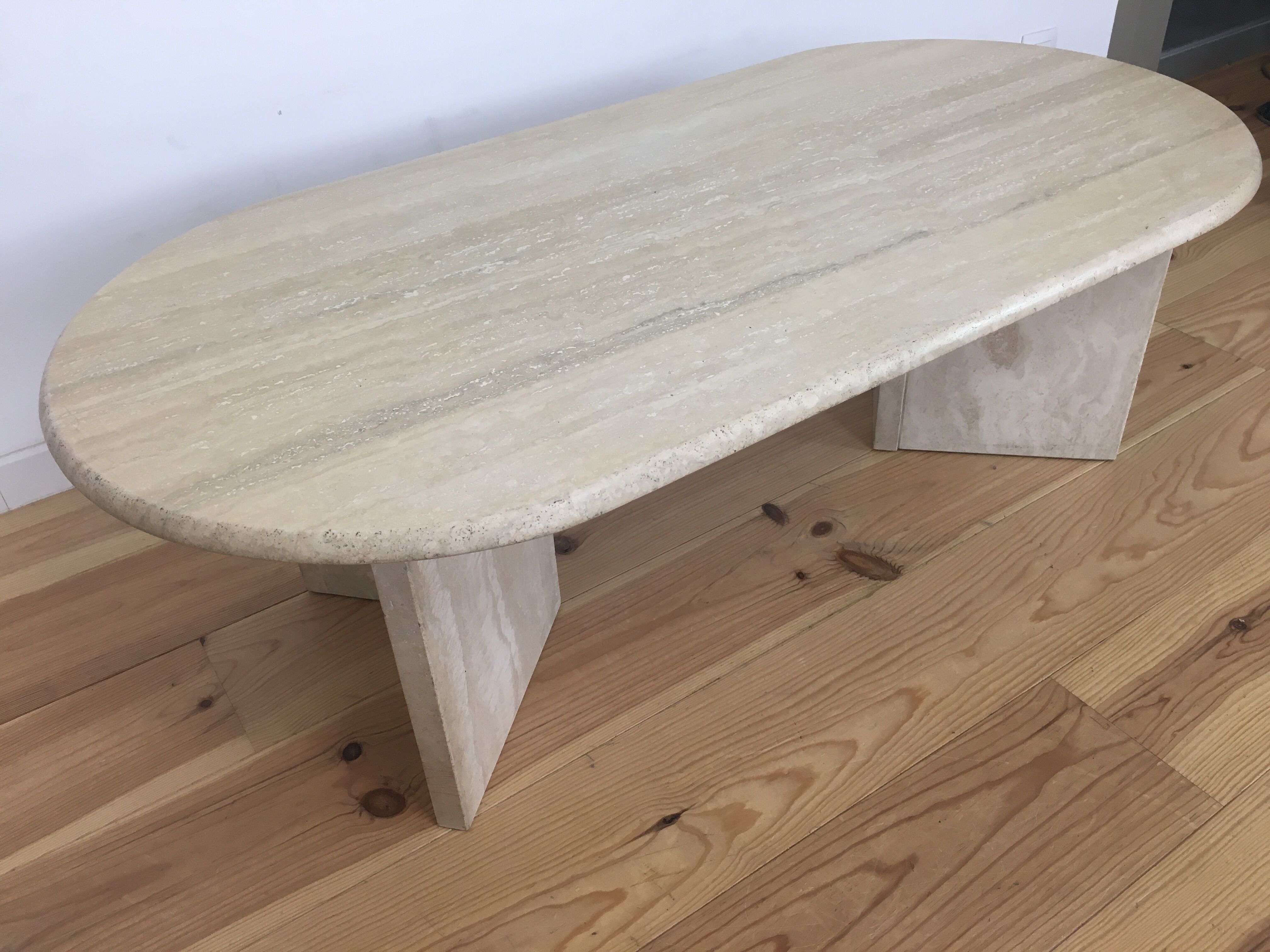 Oval coffee table in travertine