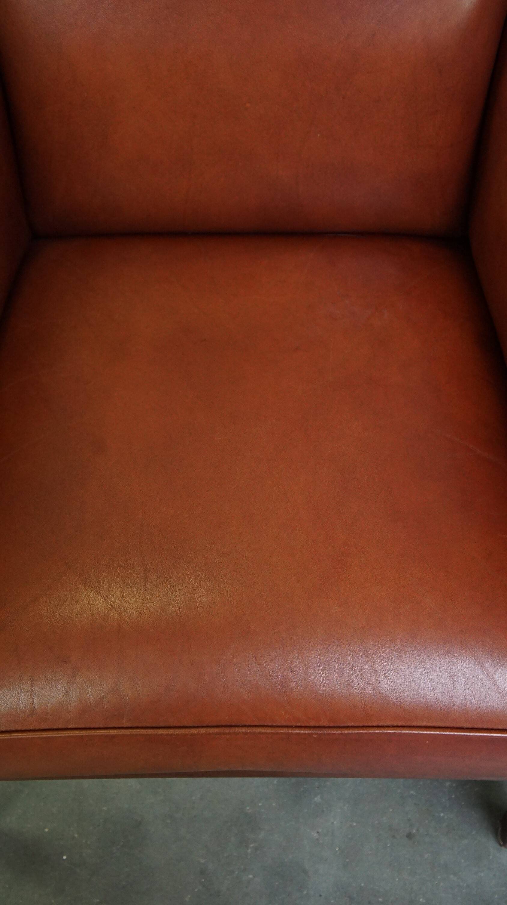 Set of 2 cognac-colored cowhide Art Deco design armchairs