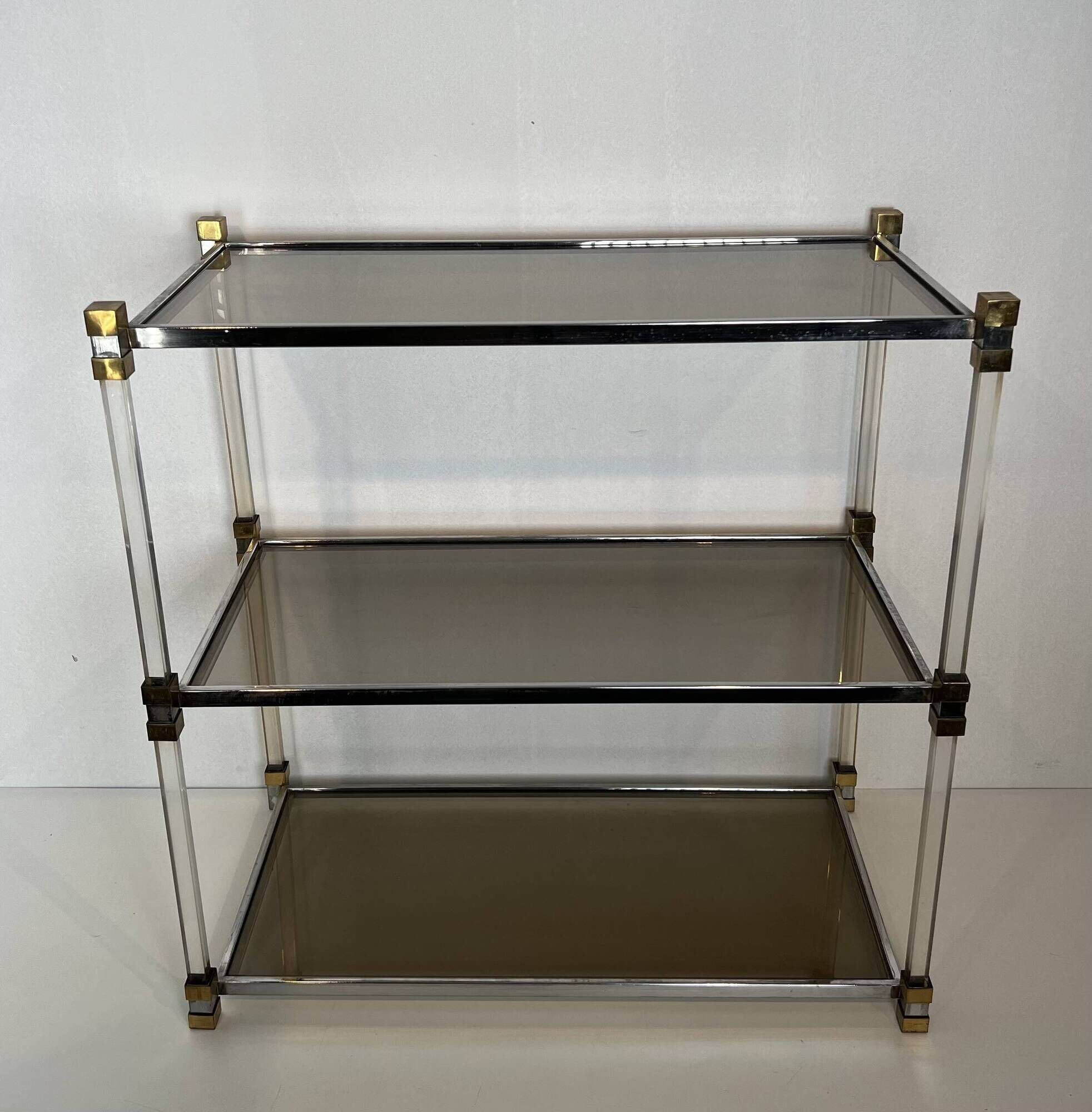 Lucite Shelf with Three Smoked Glass Shelves and Brass Ends. Work