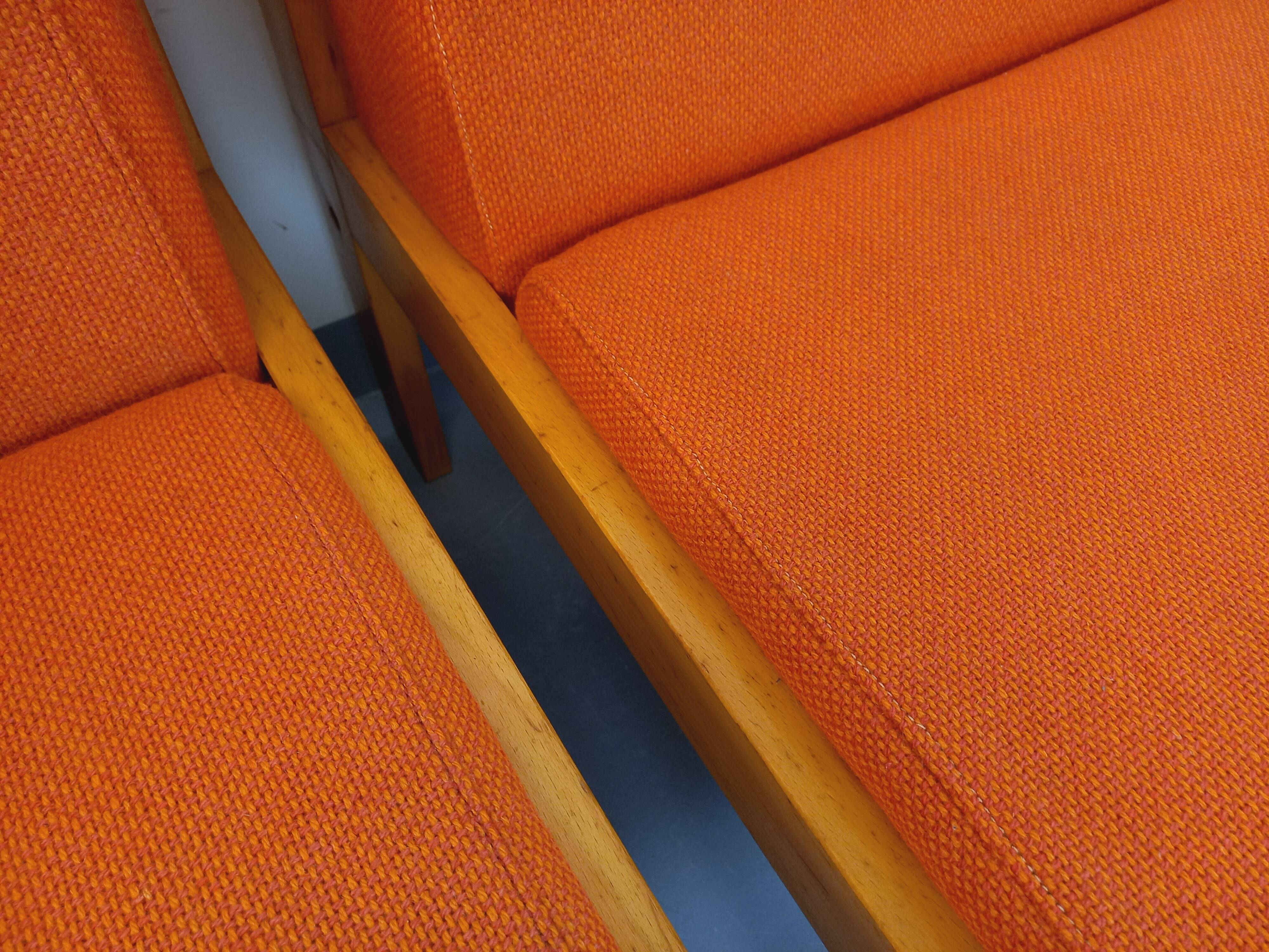 Set of 2 vintage Baumann armchairs in orange fabric and wood from the 80s