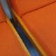 Set of 2 vintage Baumann armchairs in orange fabric and wood from the 80s