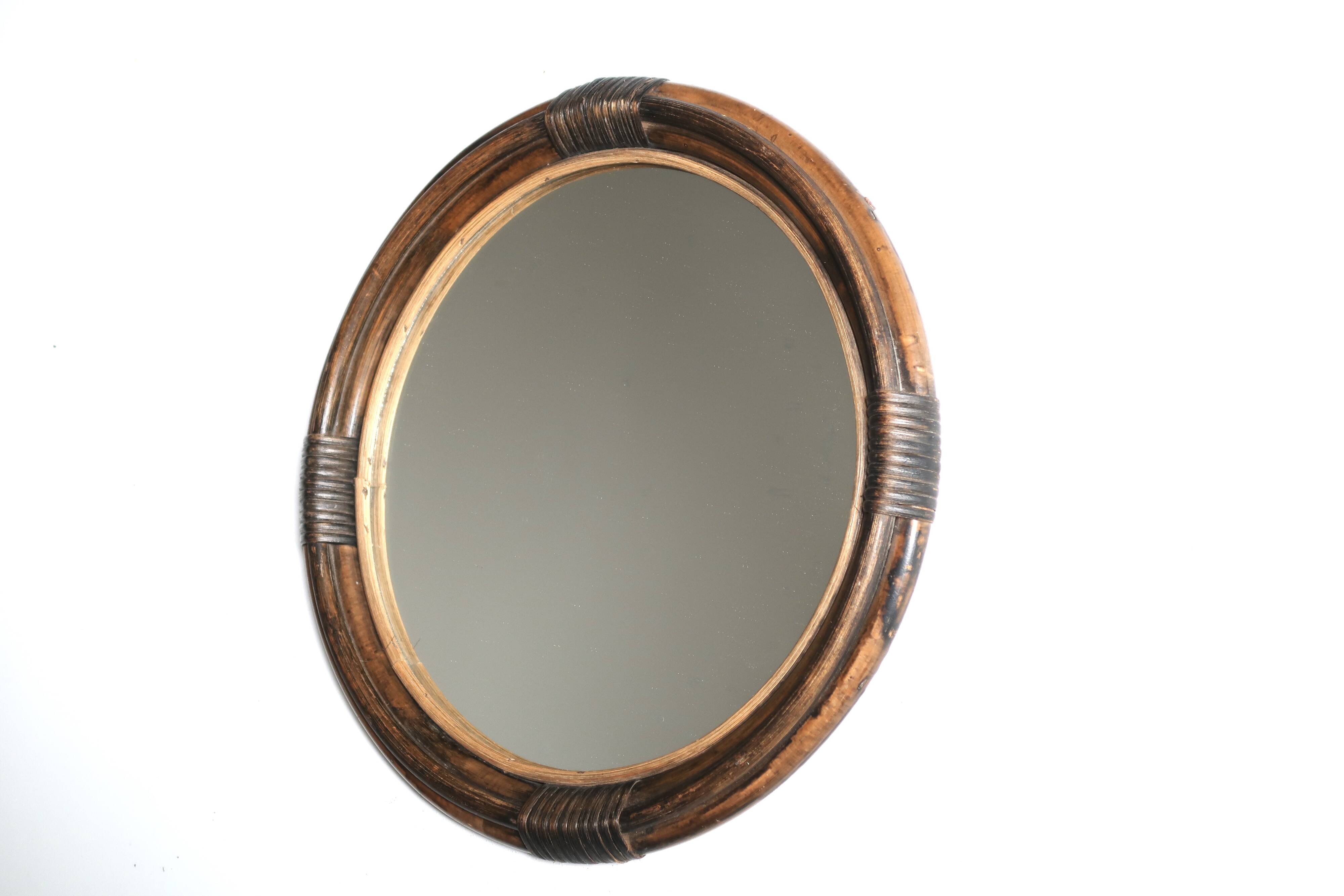 Round mirror in dark rattan, 50s