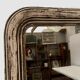 Louis Philippe mirror in wood and patinated stucco 19th century