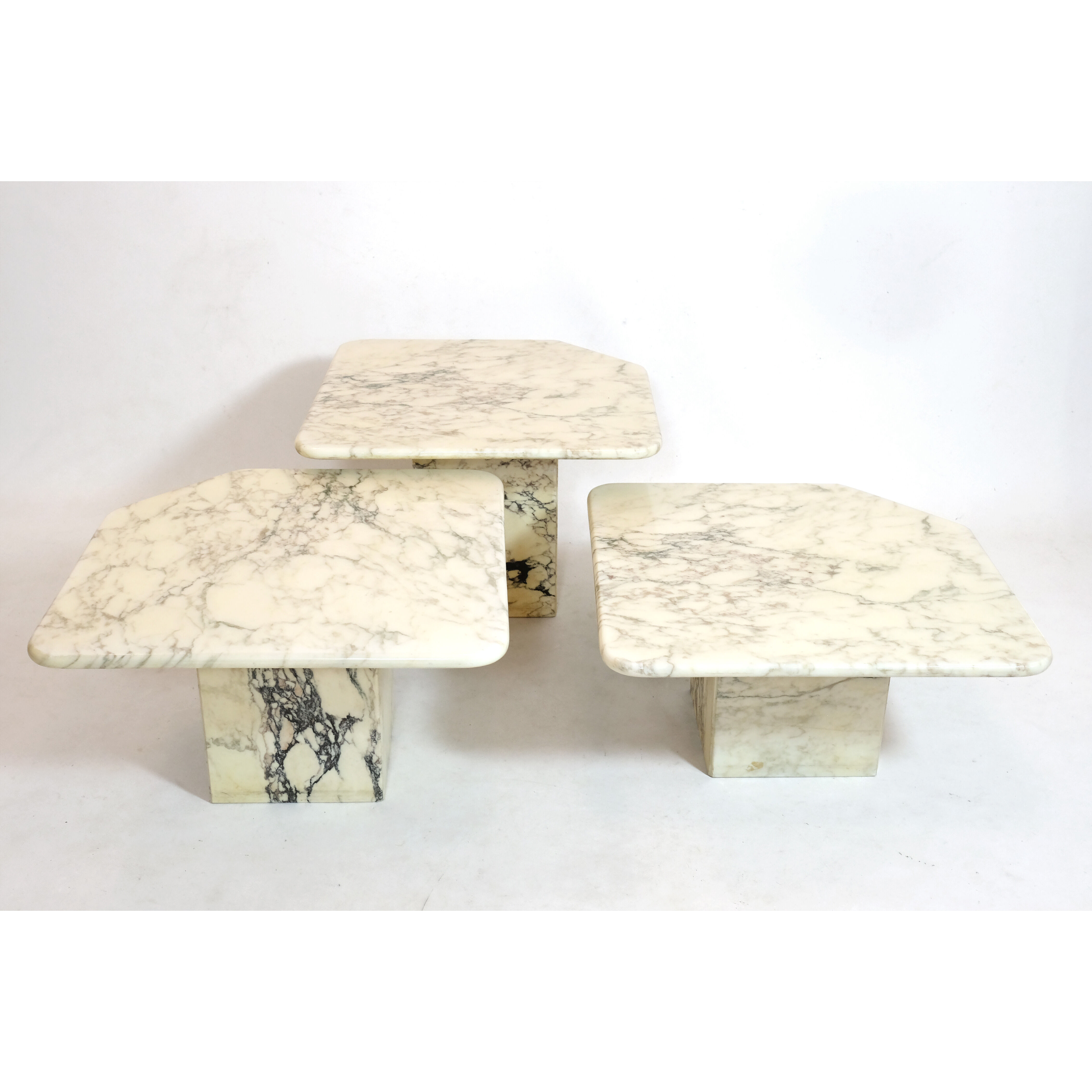 Suite of three marble trundle tables, 1970s