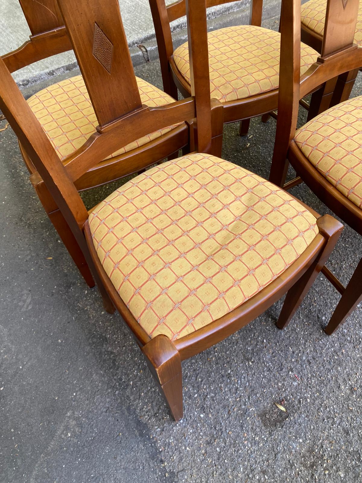 6 Syriel solid cherry wood dining chairs with yellow fabric.