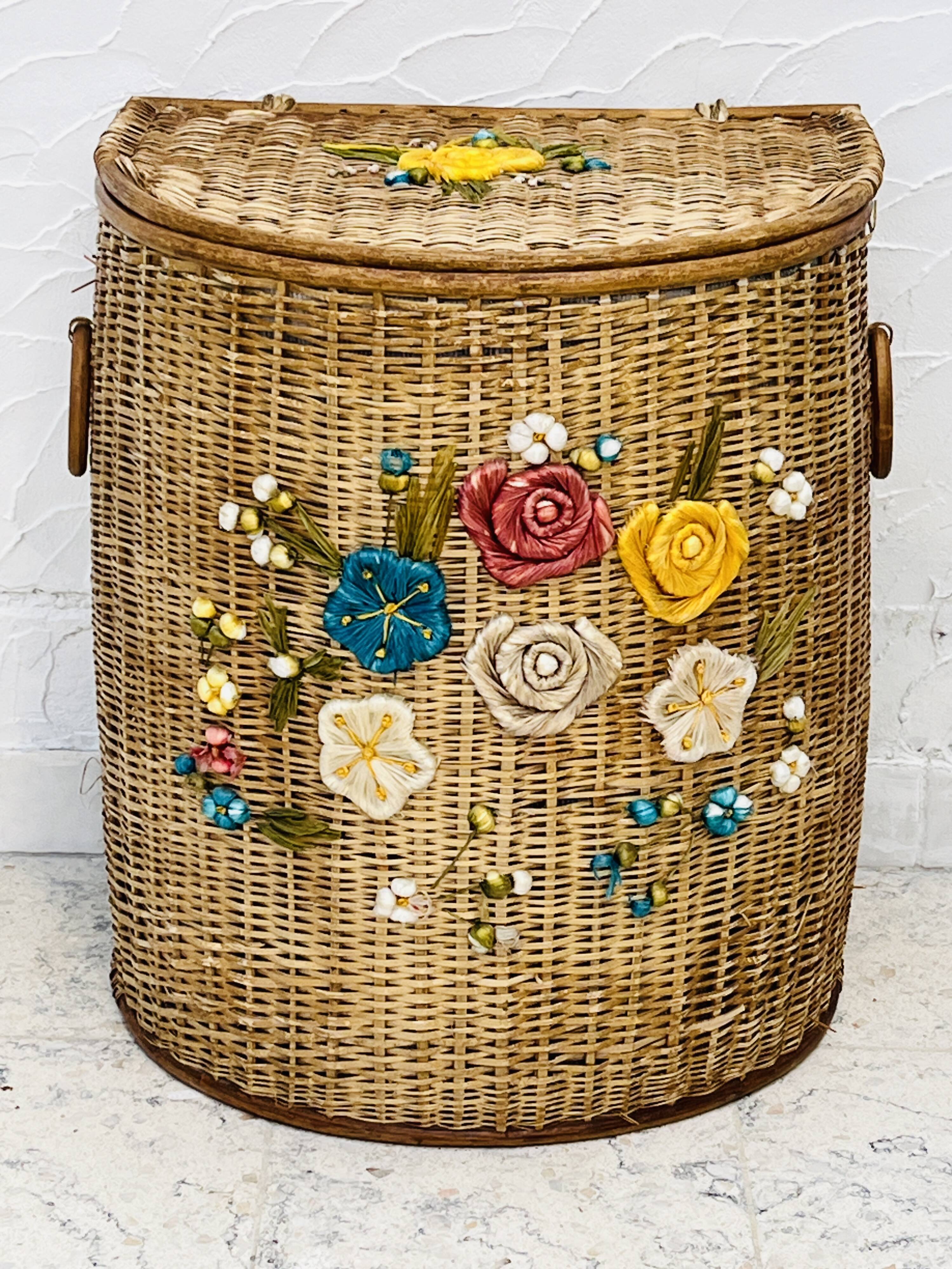 Vintage wicker mannequin with colourful floral decoration.
