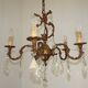 Antique French bronze chandelier with 6 lights and matching crystals.