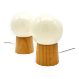 Pair of lamps with wooden base and glass globe, 1970s