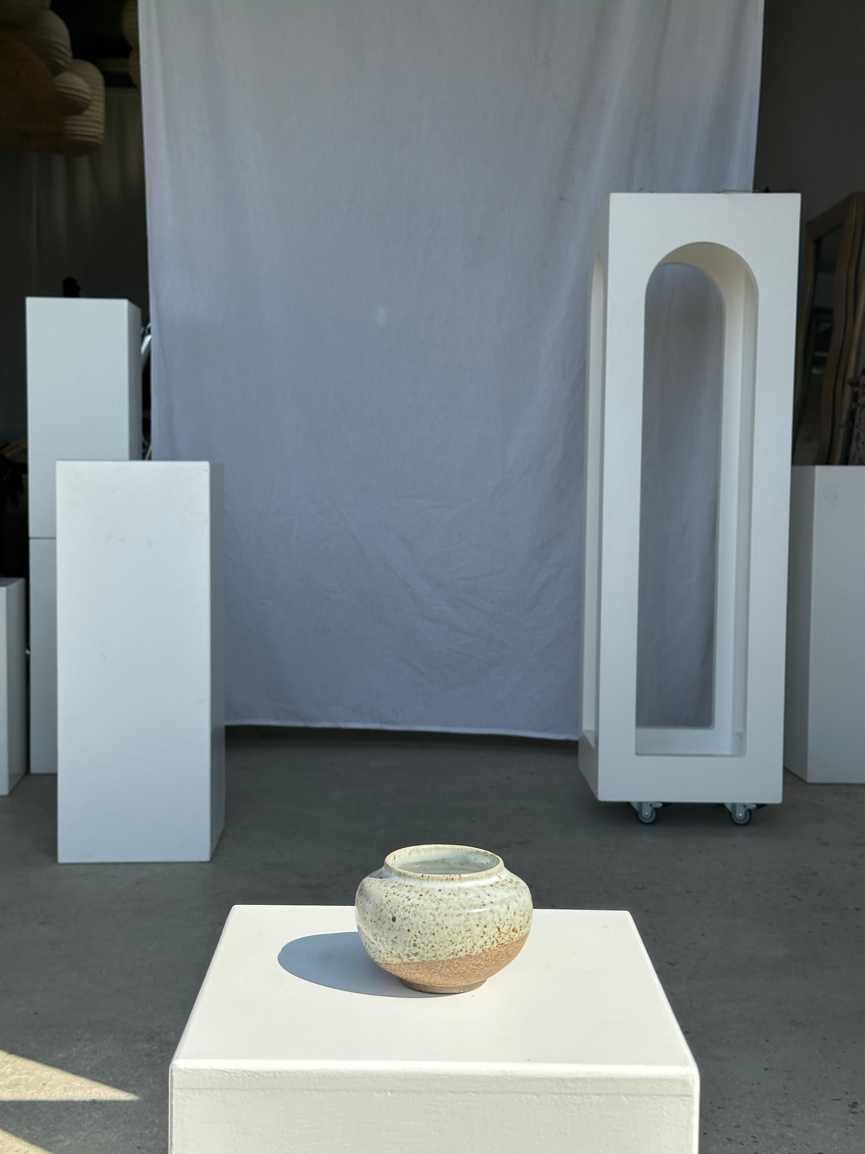 Small white ball vase tight neck in glazed speckled ceramic
