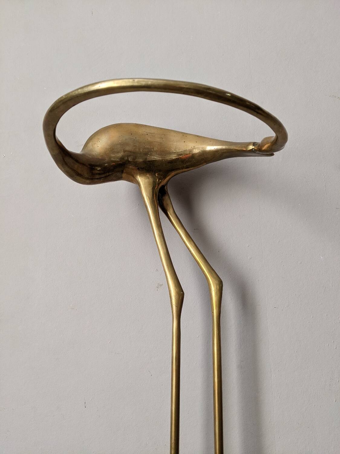 Curved brass umbrella stand