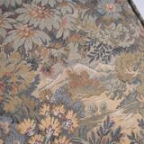 Upholstered pouf in verdure tapestry style, France, late 19th century.