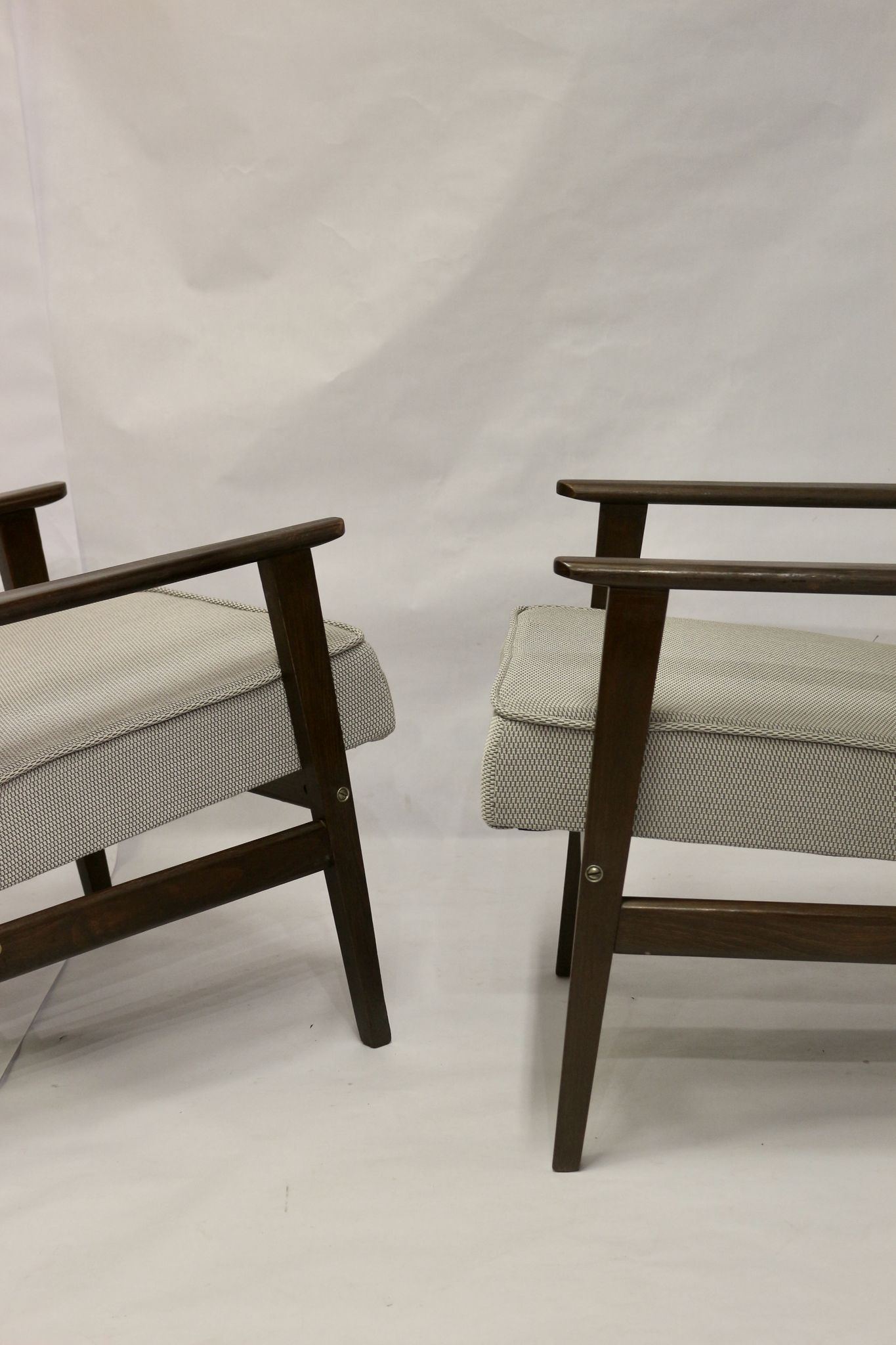 Pair of Henryk Lis armchairs 300-190s 1970s reupholstered gray textured fabric.