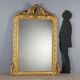 Antique eclectic style mirror in carved and gilded fir, Italy, 19th century.