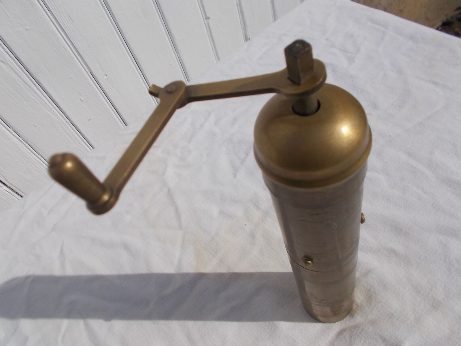 Oriental brass pepper mill