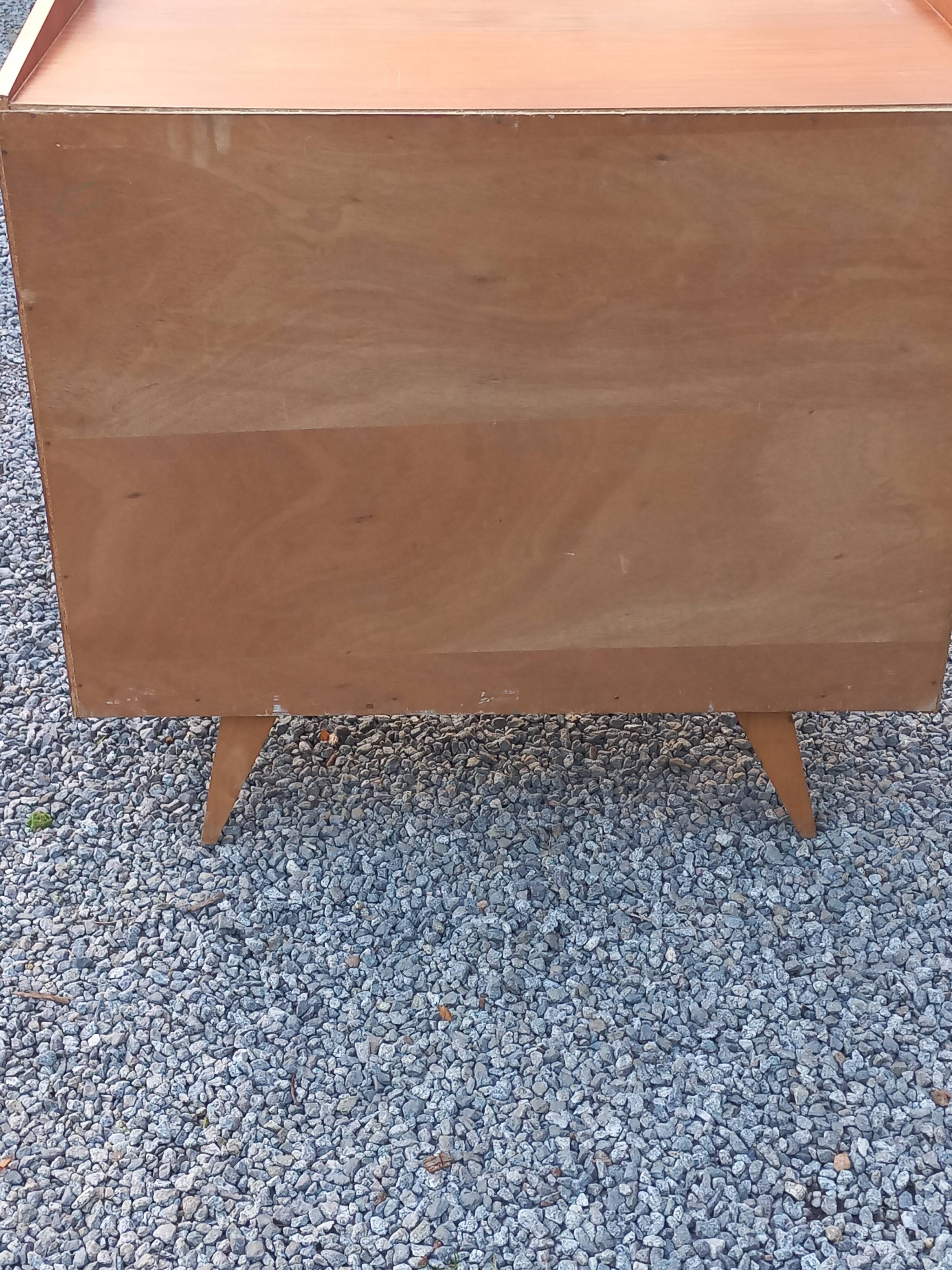 Vintage mahogany commode with metal tapered legs, 4 drawers, 1950s.