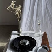 Pair of vintage black glass shell dishes D32 and D26