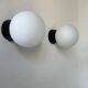 Pair of vintage Raak opaline and Bakelite wall lights, Netherlands 1970s