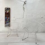 Pair of armchairs in white patinated mesh metal.