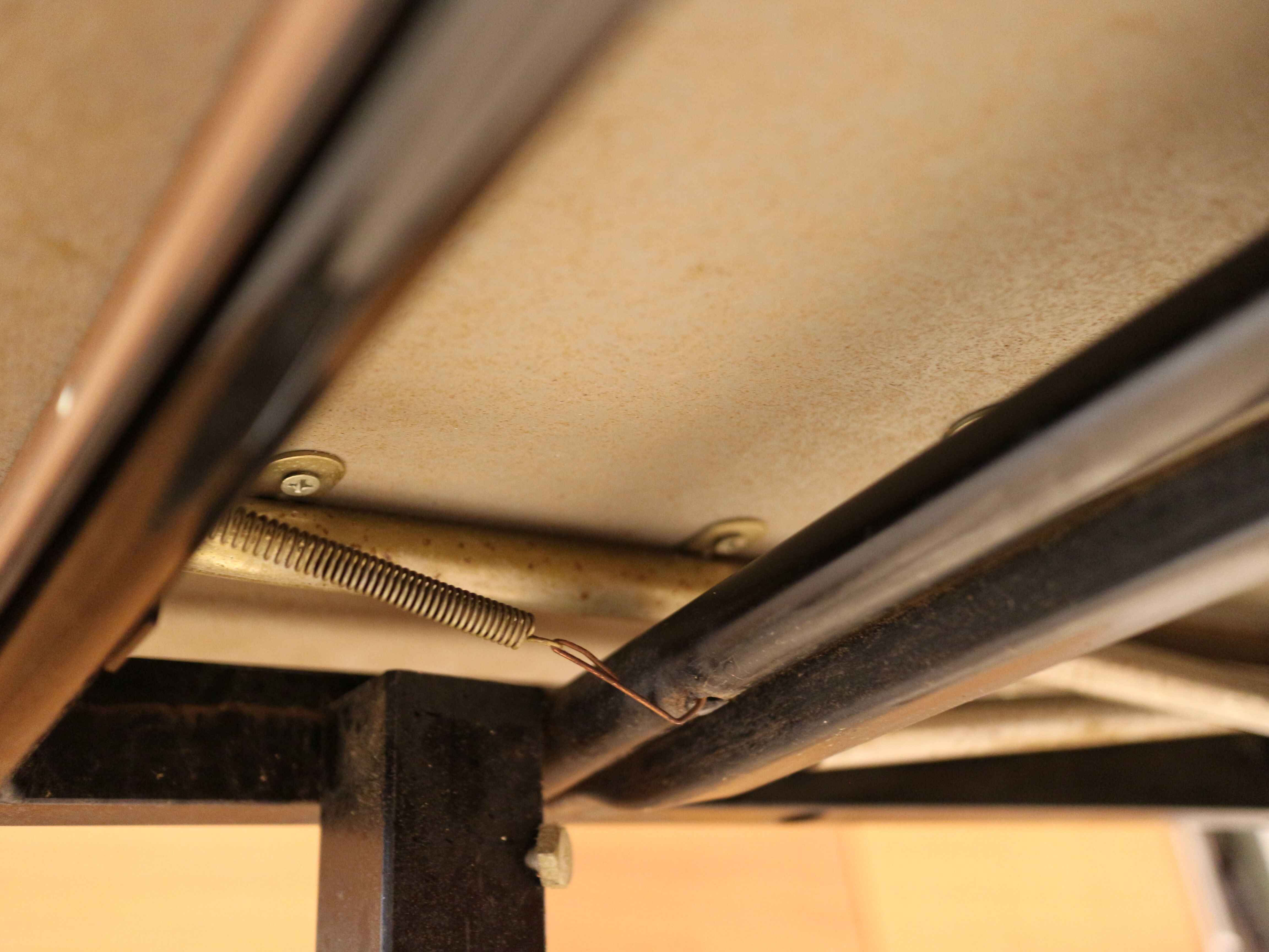 Briwn Formica table with extension cords and drawer