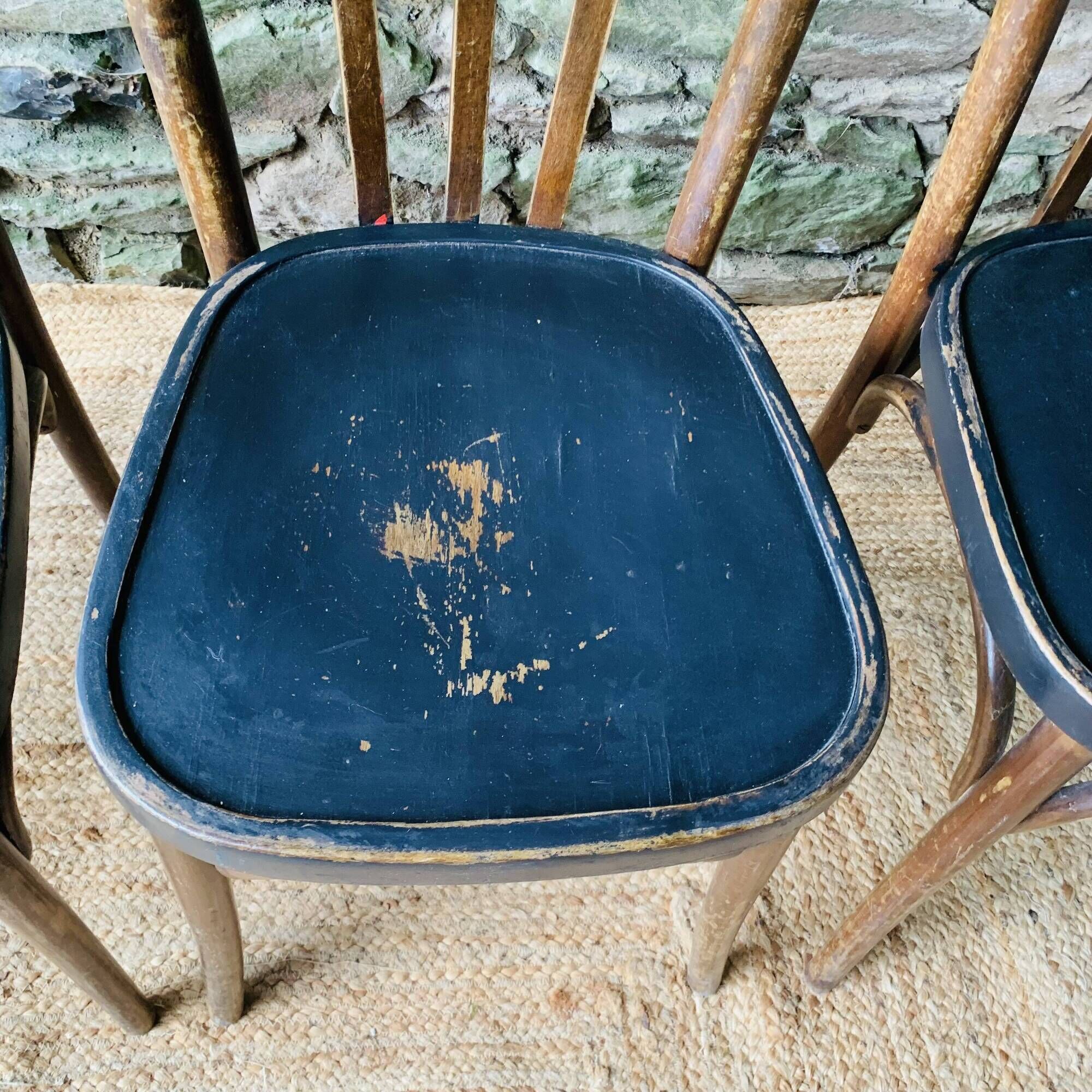 Set of four vintage bentwood bistro chairs.