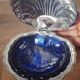 Vintage ashtray in silver metal and a blue glass part that goes inside in the shape of a saint jacques shell