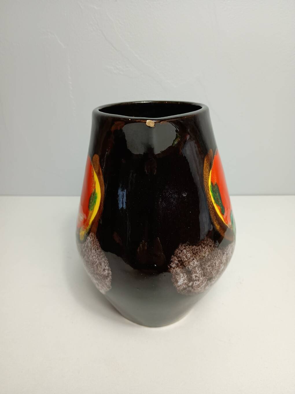 Brown ceramic pitcher with coloured patterns signed Bresse.