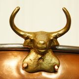 Copper cauldron with golden bronze bull heads