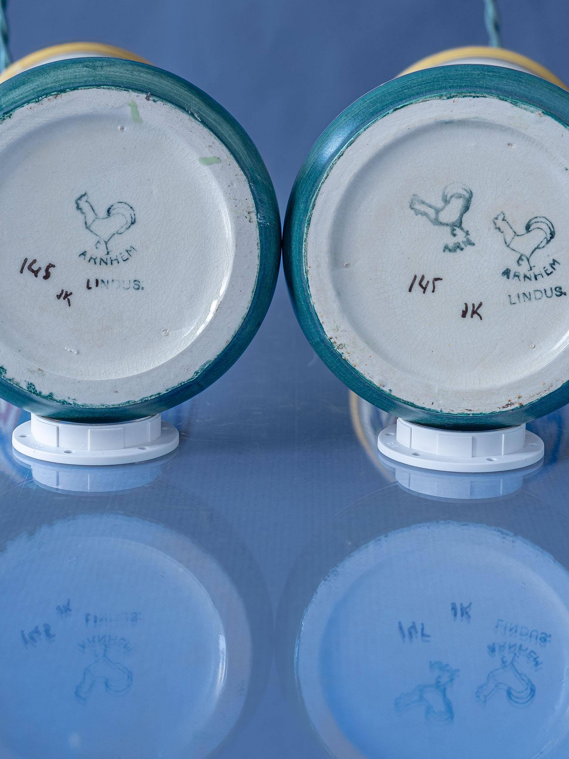 Pair of hand-painted ceramic table lamps in Dutch Art Nouveau–Art Deco style, 1910–1917.