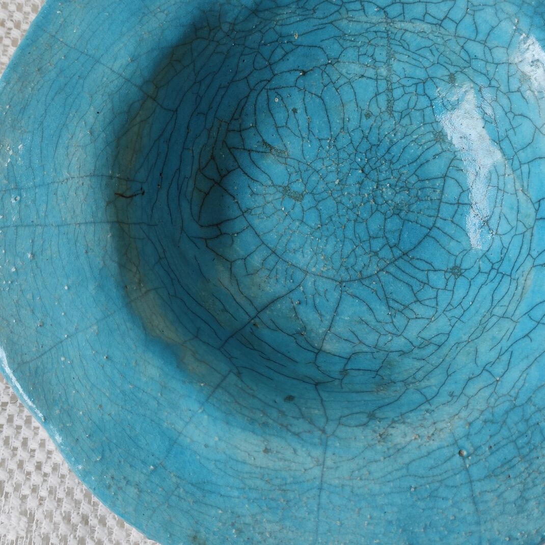 Empty turquoise raku pocket