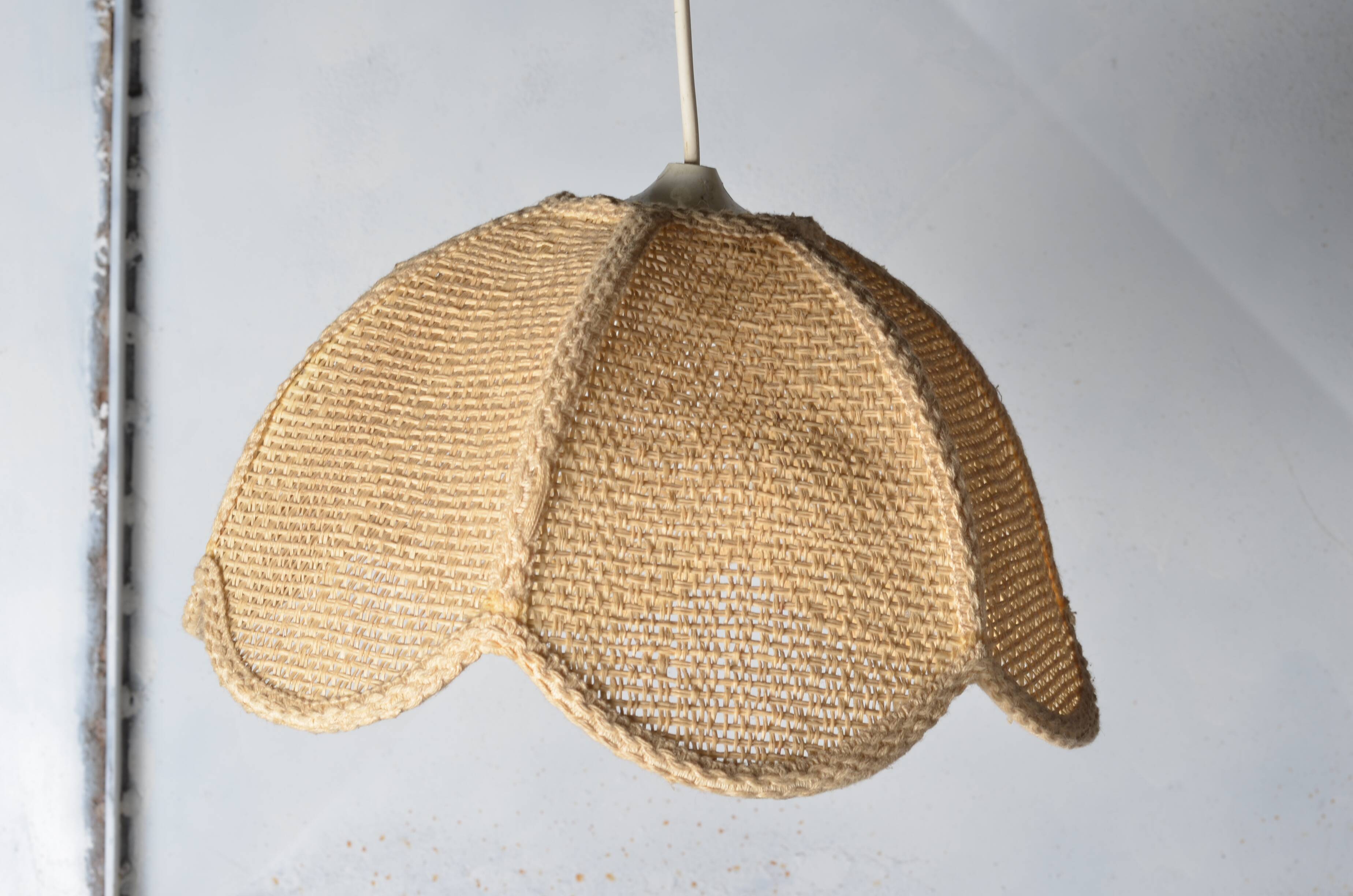 Braided flower pendant