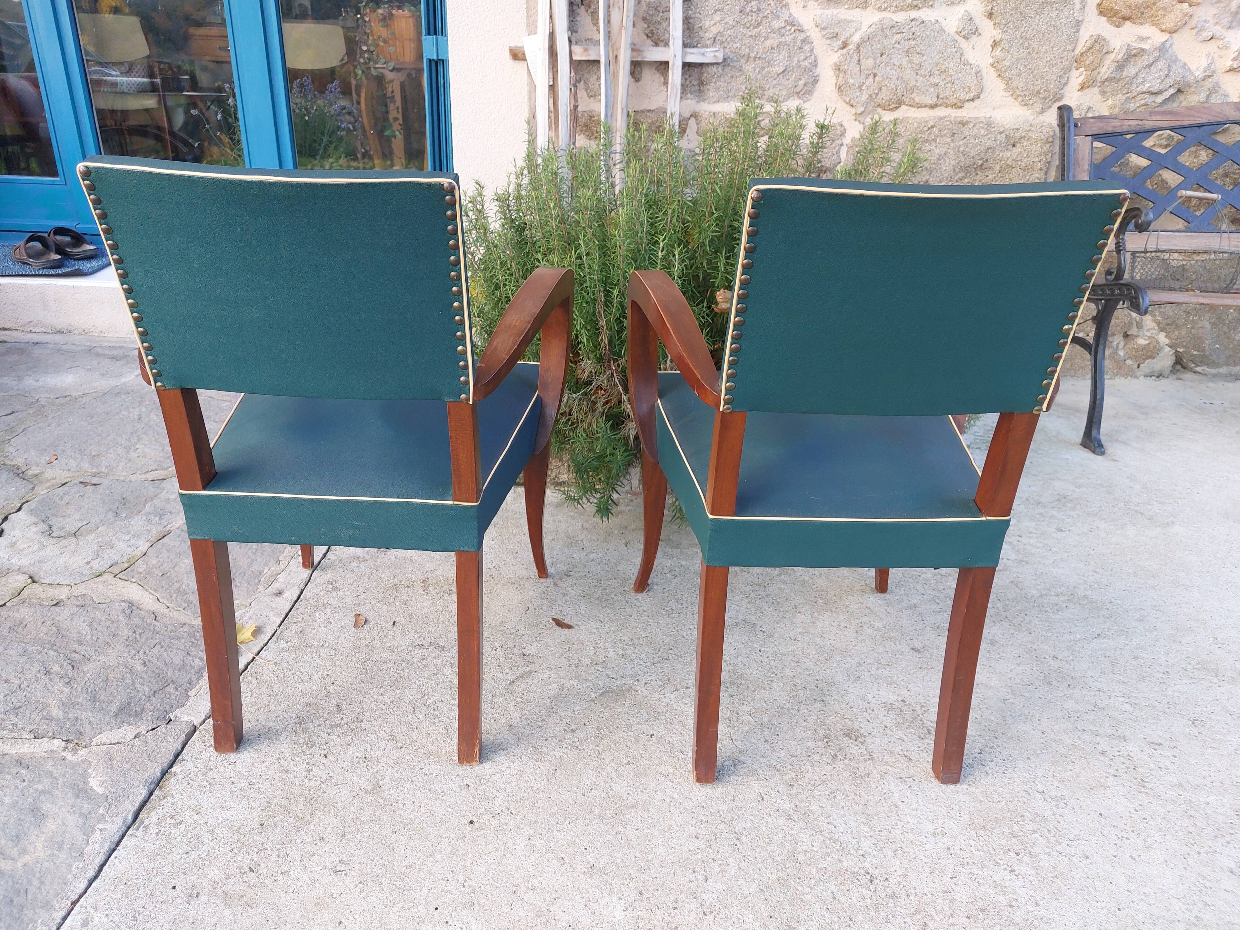pair of dark green bridge armchairs